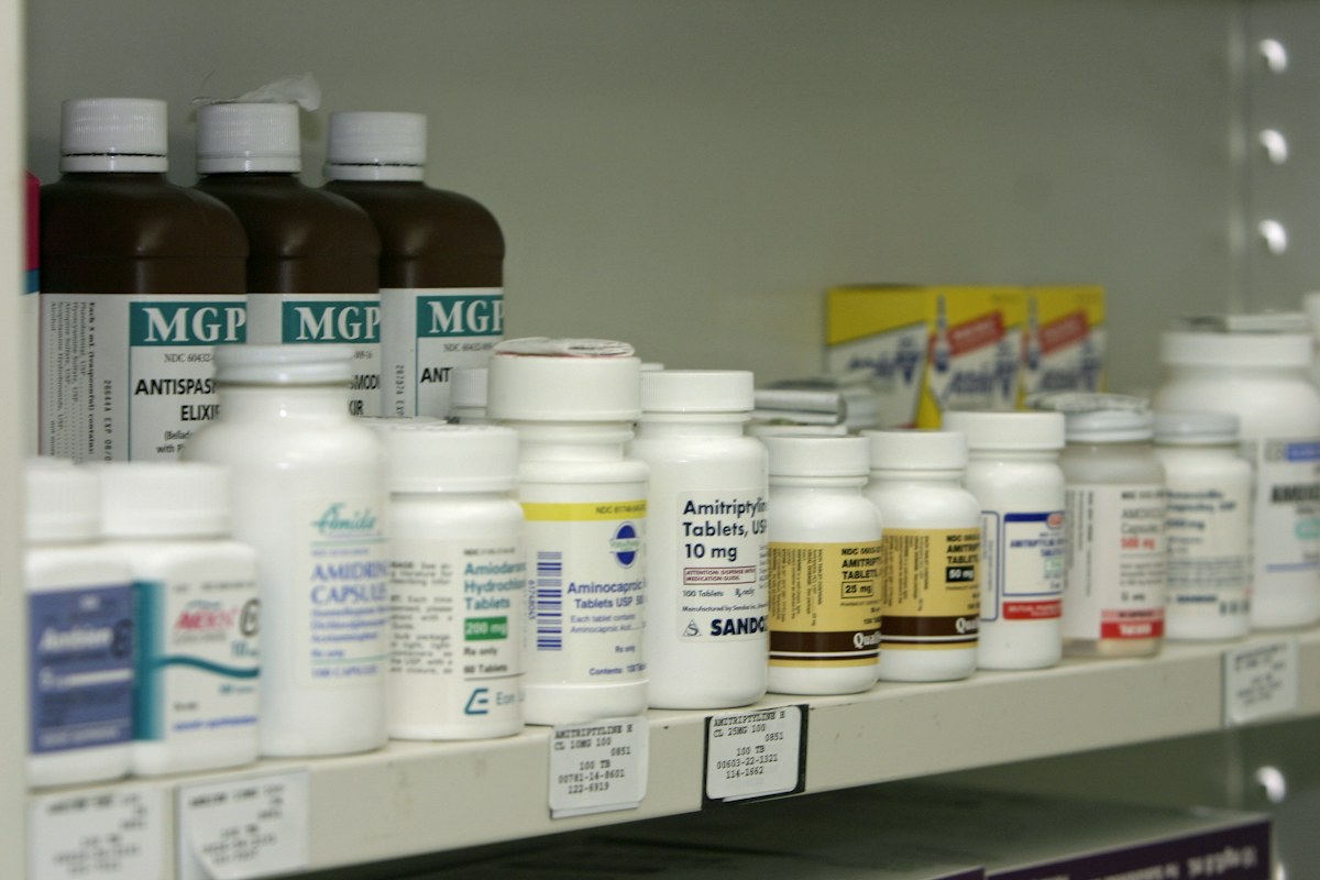 Medicine products arranged on pharmacy shelves