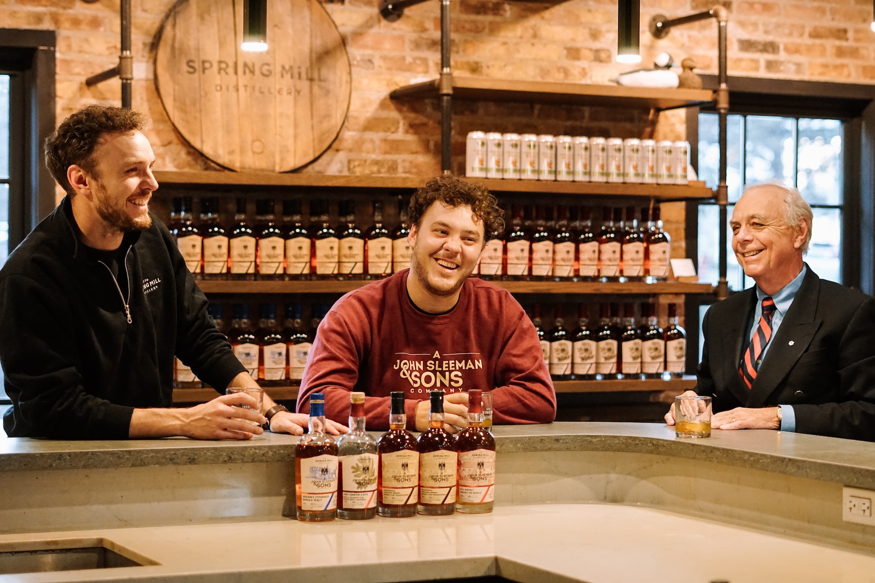 Left to right: Cooper Sleeman, Quinn Sleeman, and John W. Sleeman at Spring Mill Distillery.