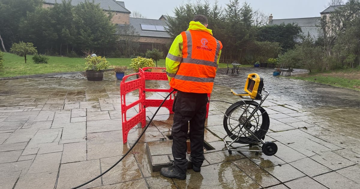 Outdoor drain being cleaned to prevent blockages