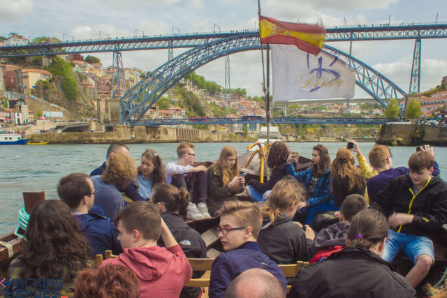 The bridge seen from the waterfront, participants in the foreground