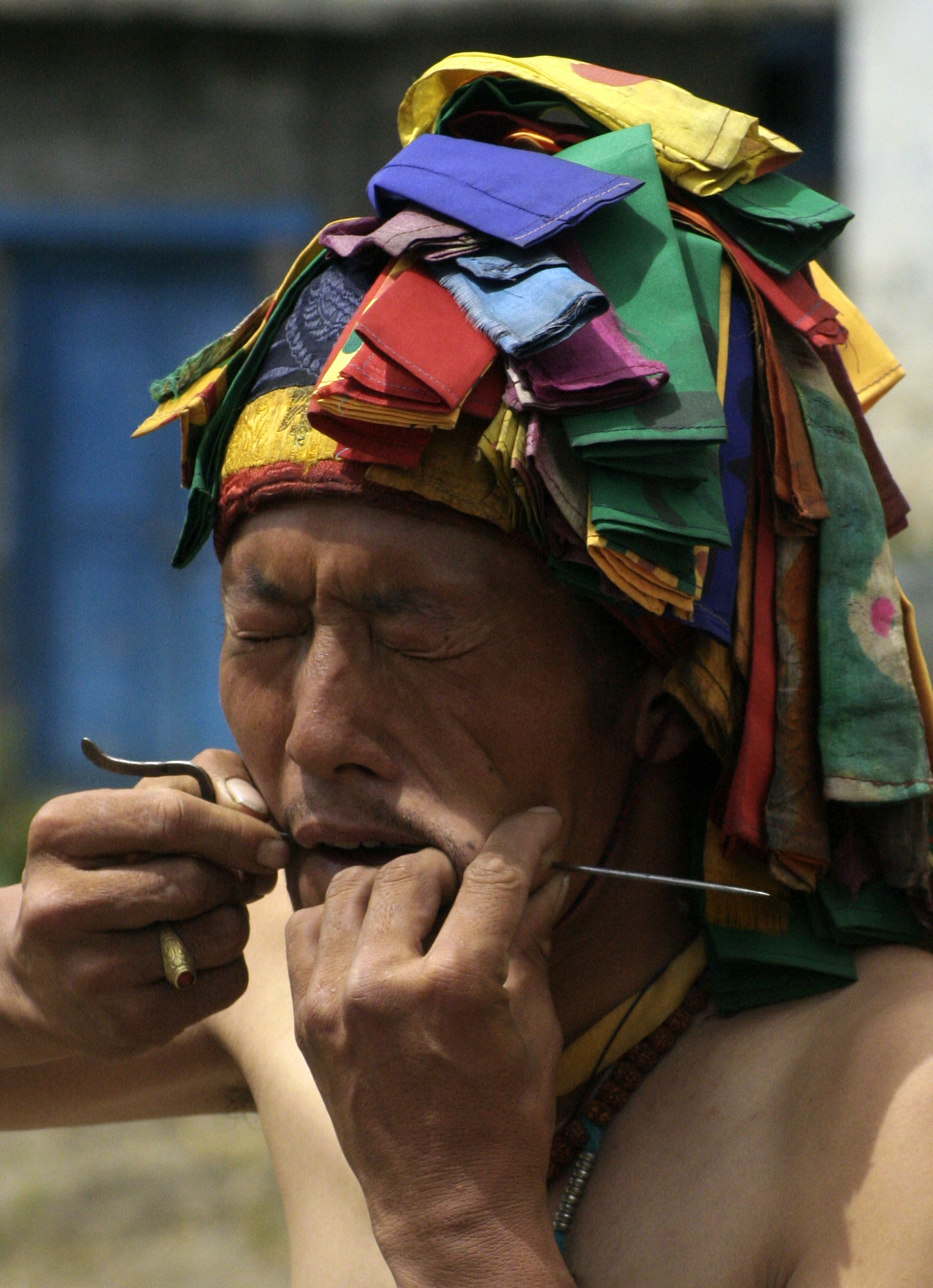Ancient monastery with prayer wheels and monks in meditation