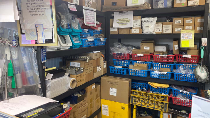 Shelves and bins of replacement appliance parts