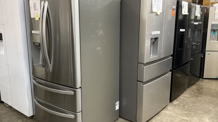 Stainless refrigerators with Scratch N Dent labels