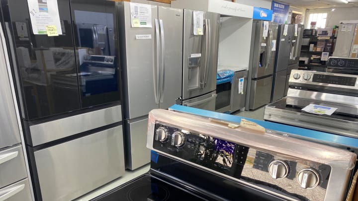 French-door refrigerators in black glass and stainless