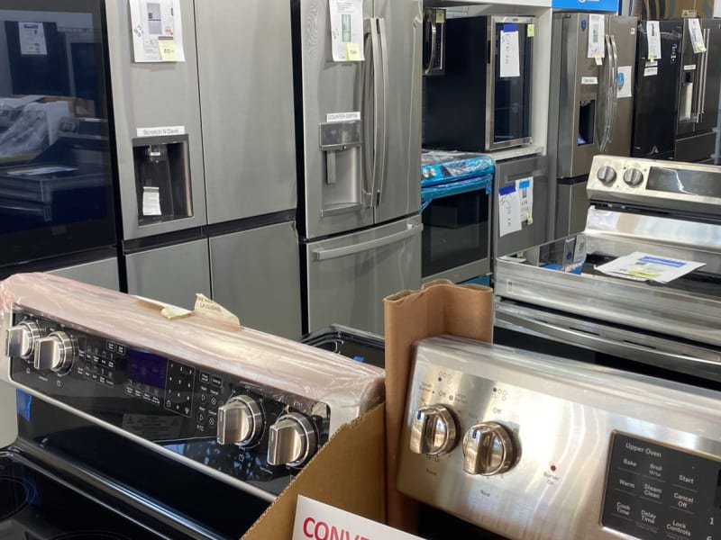 Stainless French-door refrigerators and new ranges lined up inside Barn Appliances on Hwy 43 N in Leoma, TN