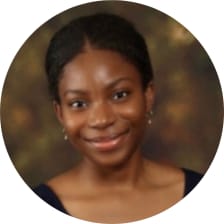 Portrait photo of me smiling with a softly blurred background.