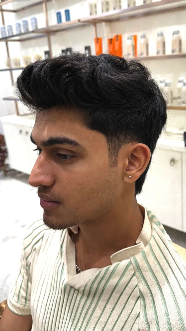 a man with a short black haircut