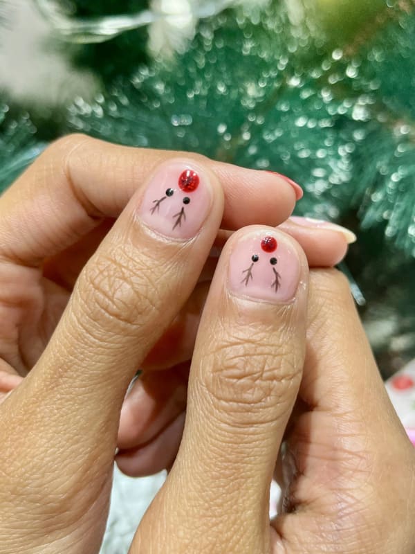 a person with a christmas tree in the background