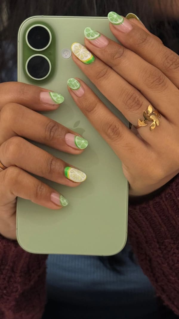 a woman holding a cell phone with a green case