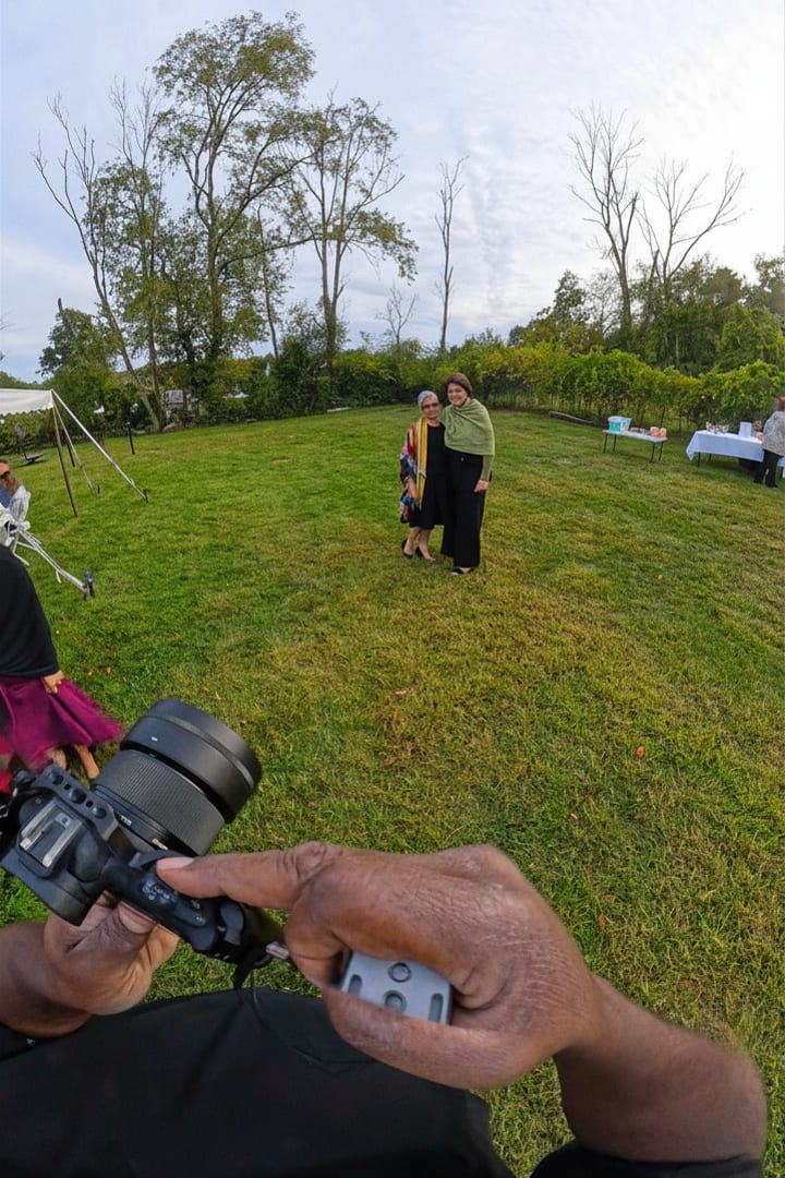 Roaming photo booth attendant capturing candid moments at outdoor Massachusetts event, Video In 360.