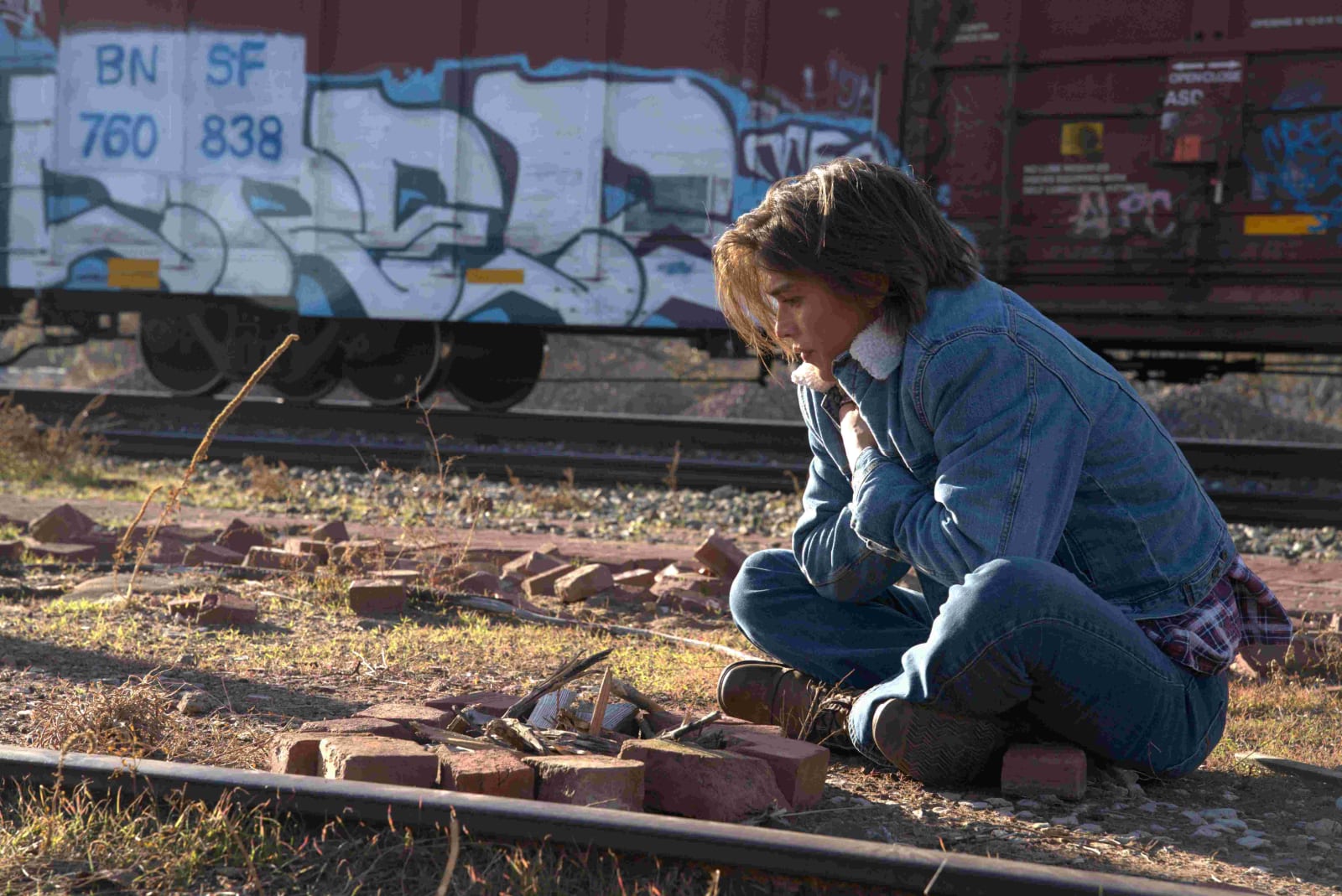 Hawk at the train station with his guitar, from The One
