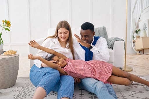 Happy family enjoys cool air from new air conditioning system