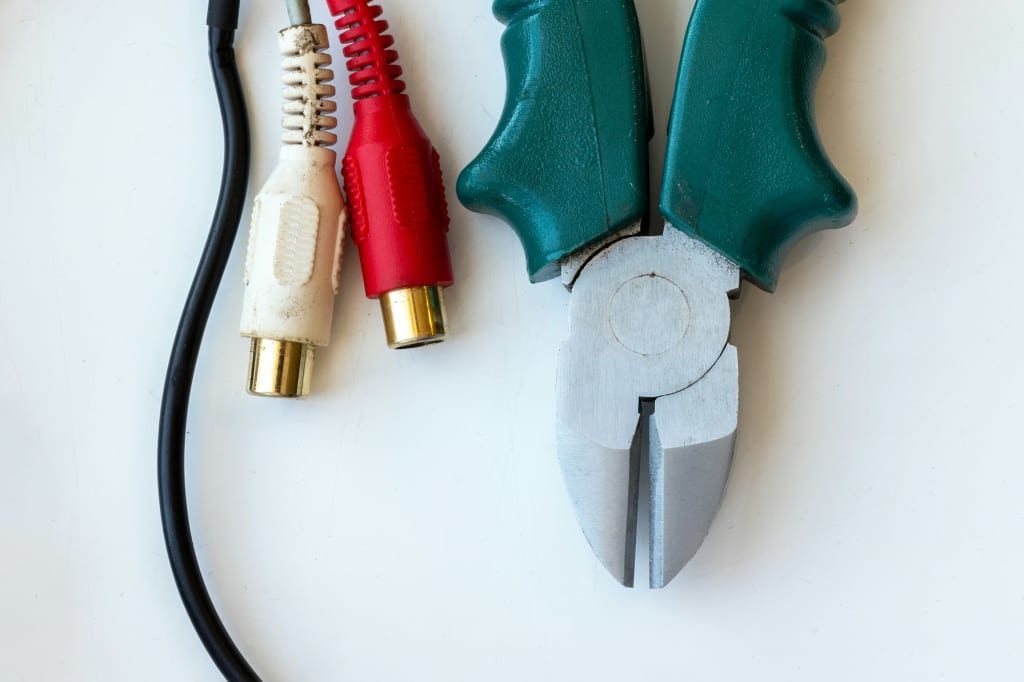Handle pliers, wire and dirty audio video connectors