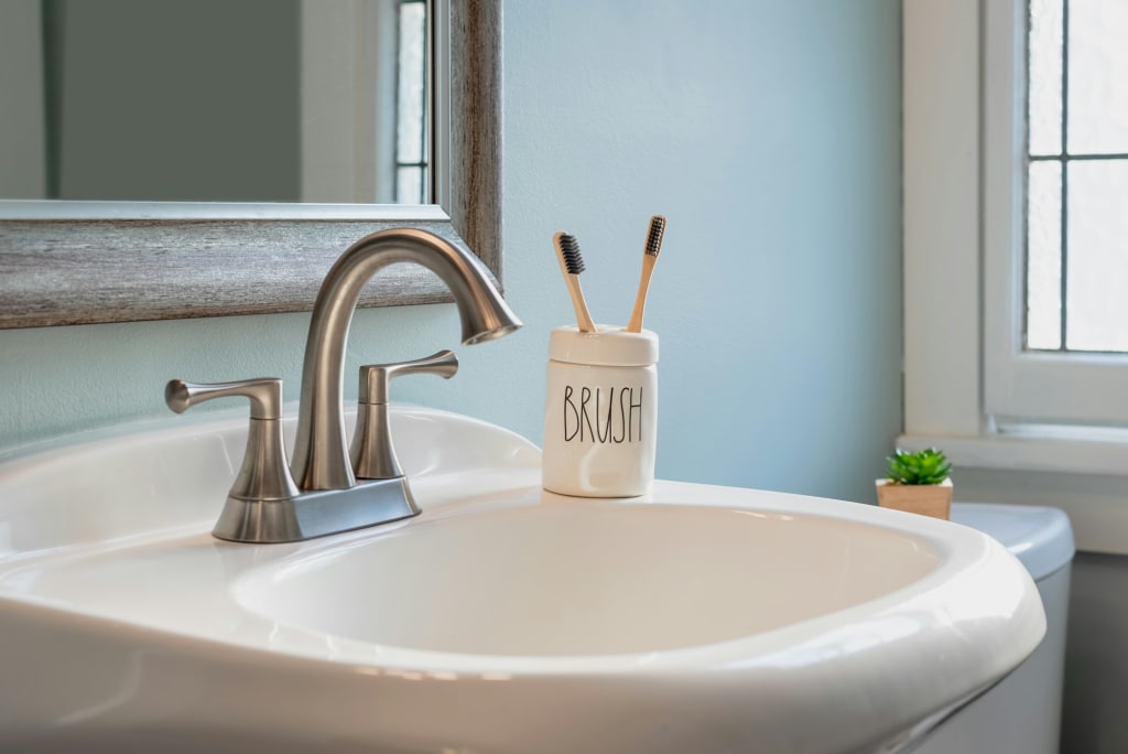 Eco friendly bamboo toothbrushes on the bathroom sink