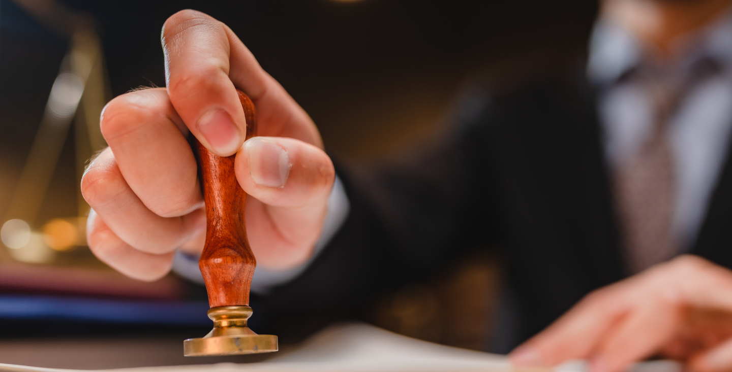 business man stamping a document