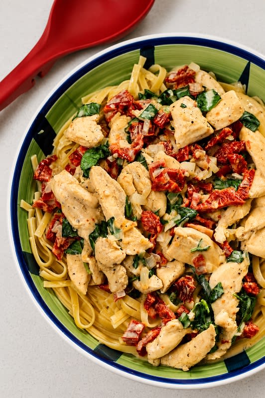 Primi Fusilli Con Pollo with Sun-Dried Tomatoes, Chicken, and Mushrooms in Alfredo Sauce