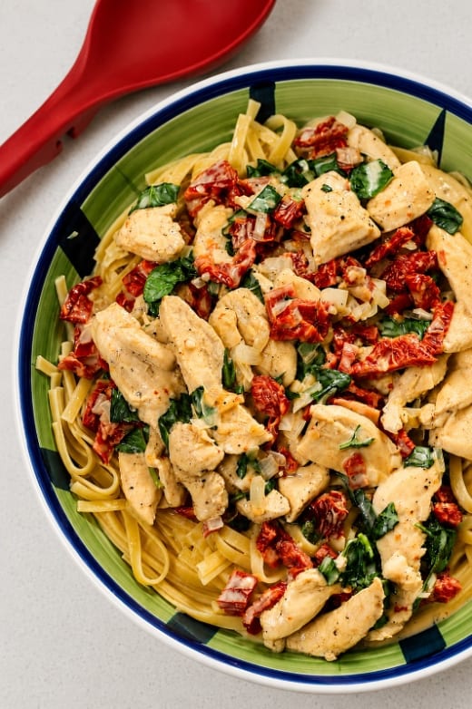 Primi Fusilli Con Pollo with Sun-Dried Tomatoes, Chicken, and Mushrooms in Alfredo Sauce