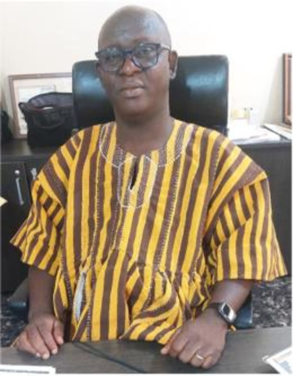 African agricultural scientists examining improved drought-resistant cowpea crops in research field in Ghana