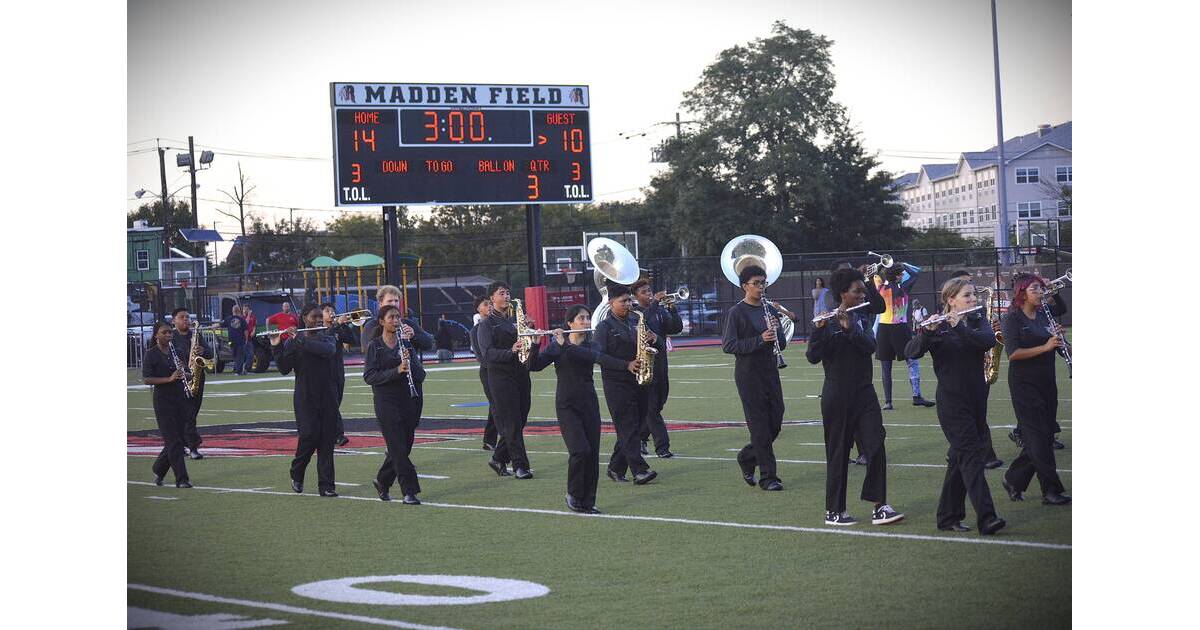 ** Rahway High School marching band performing their innovative iBand halftime show on football field