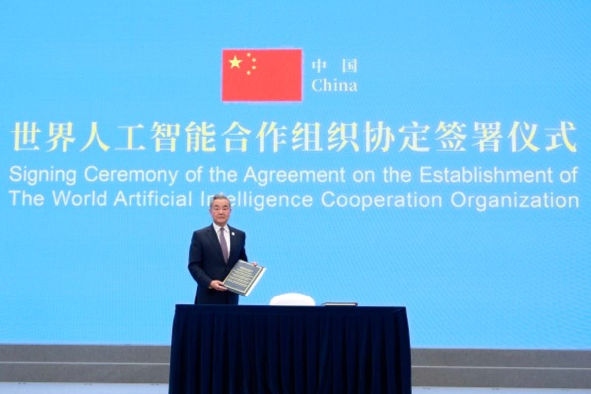 Representatives from multiple nations gathered together signing international AI cooperation agreement in Shanghai