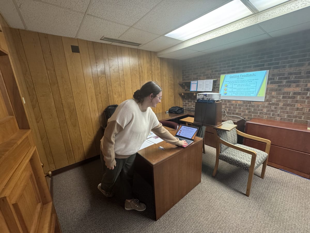 High school students collaborating on project in modern downtown workspace Innovation Hub