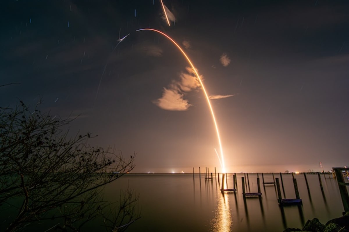 SpaceX Falcon 9 rocket lifting off at night with bright exhaust trail from Cape Canaveral launch pad