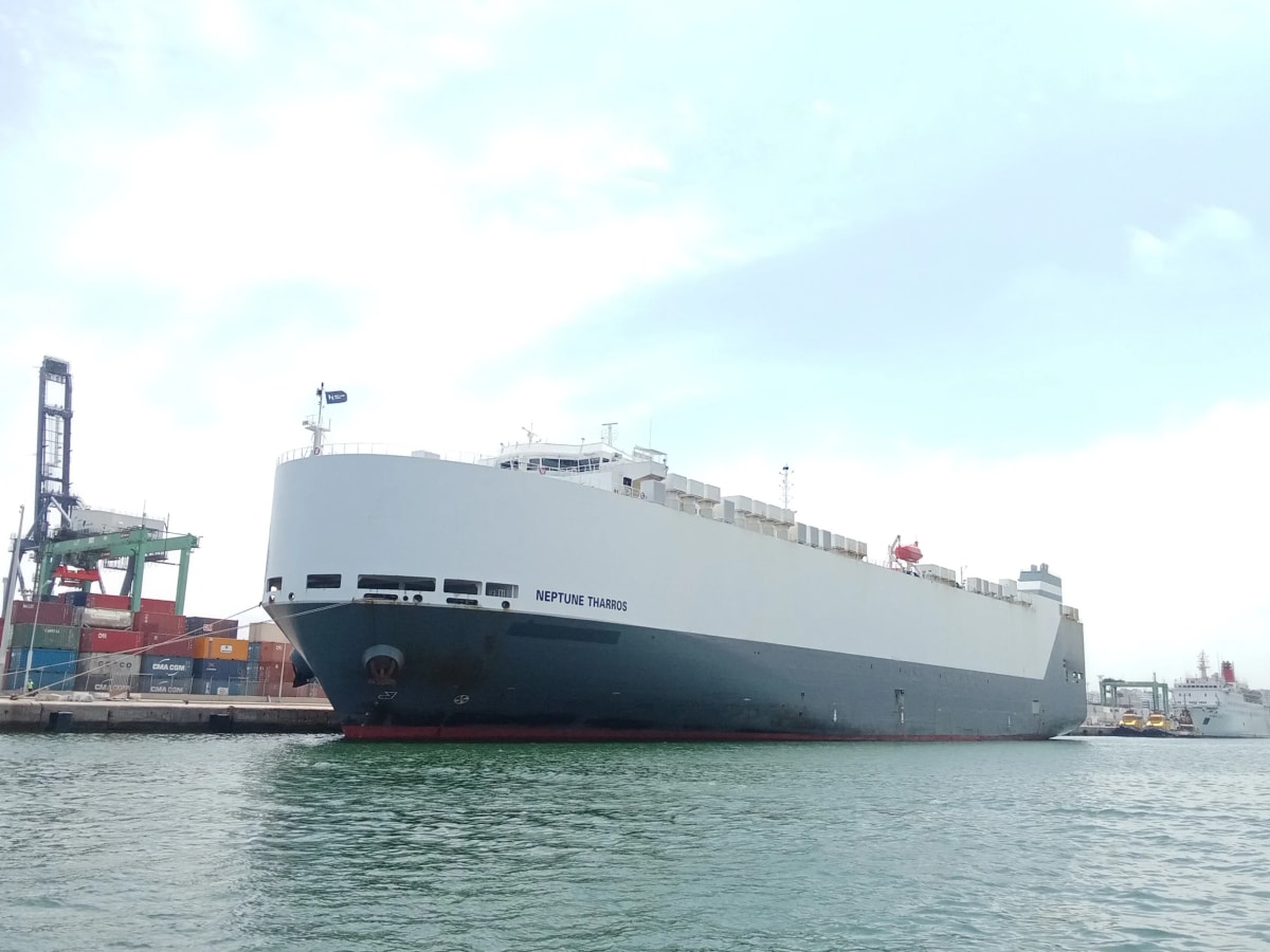 Large car carrier vessel Neptune Tharros sailing on ocean waters ready for emissions technology upgrade