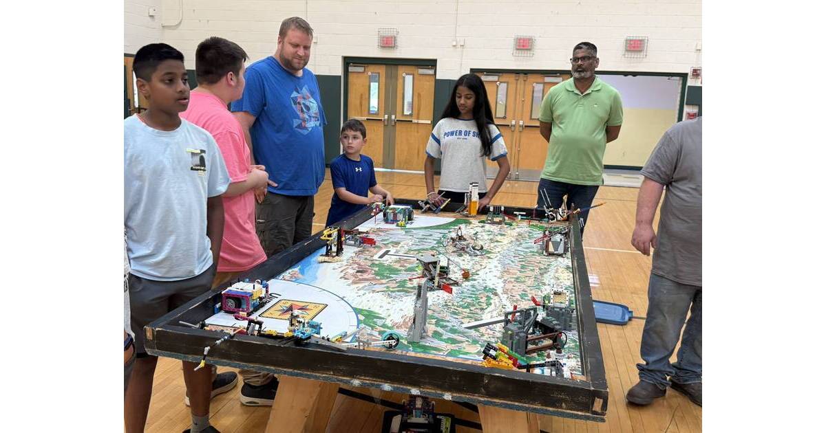 Students demonstrate robotics projects to families at Innovation Station's annual Robotics Night event