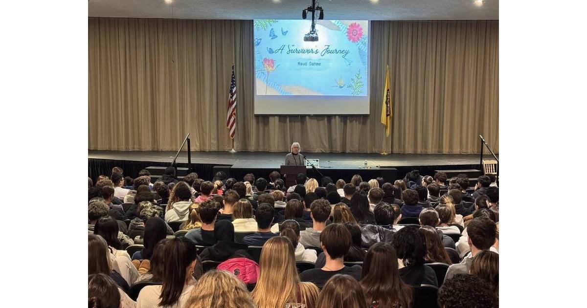 Holocaust survivor Maud Dahme speaking to attentive high school students in classroom setting