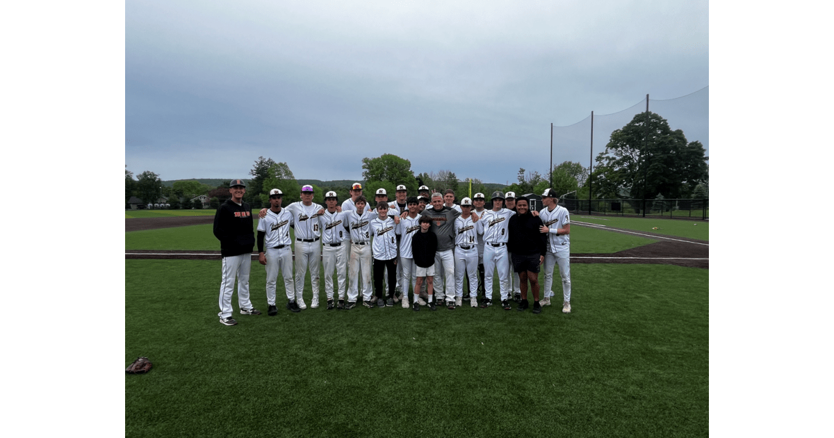 ** Coach Gary Poyer of Hackettstown High School Tigers baseball team celebrating historic 311th career win