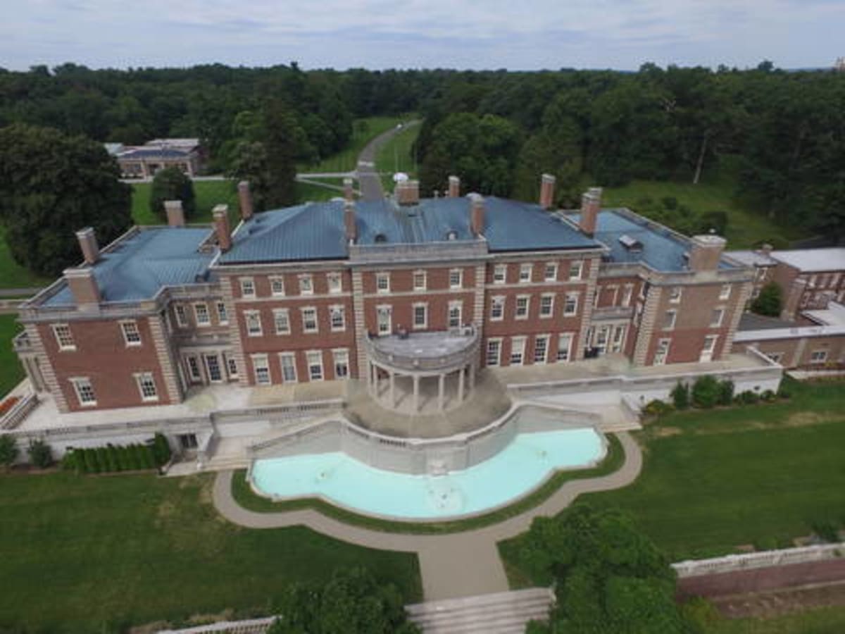 Fairleigh Dickinson University Florham Campus building exterior with green lawn and trees