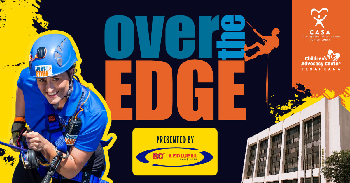 Volunteer rappelling down multi-story building during community fundraising event for children's advocacy