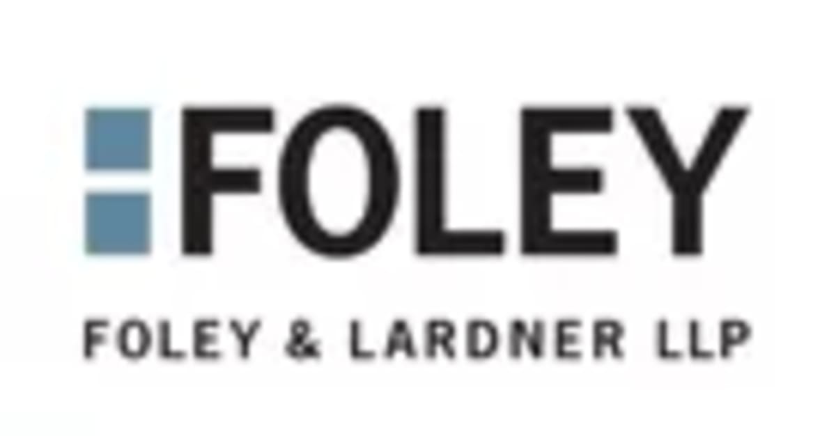 ** Olympic athlete wearing high-tech insulated jacket with advanced thermal management system at winter sports venue