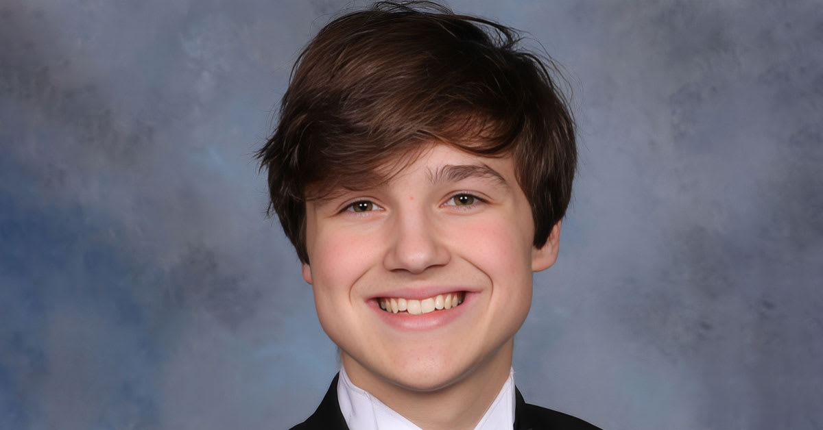 High school senior James Treick smiling in academic setting at Tate High School Florida