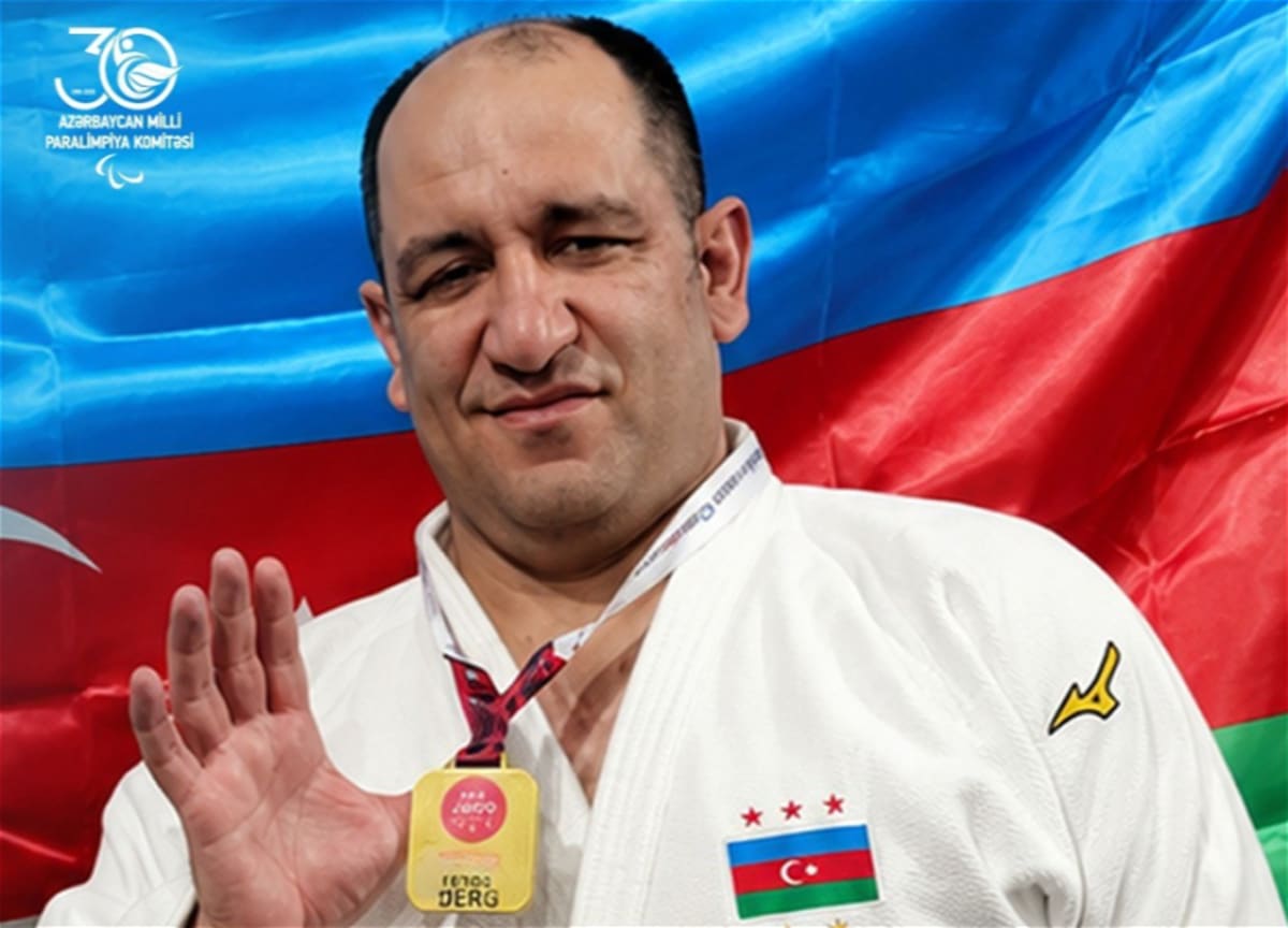 Azerbaijani para judoka Ilham Zakiyev competing in white judogi on competition mat