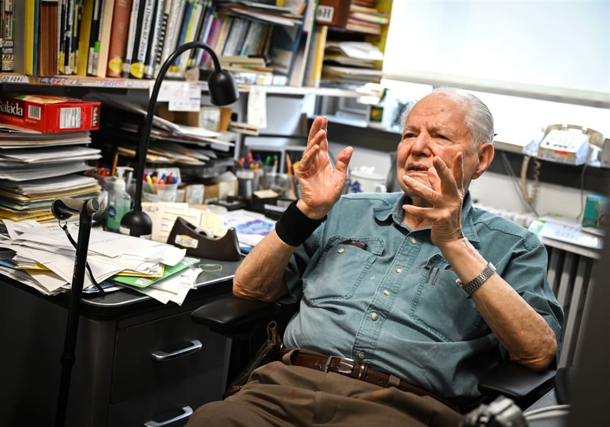 One-hundred-year-old physicist Jim Choyke holds a silicon carbide wafer in his University of Pittsburgh office