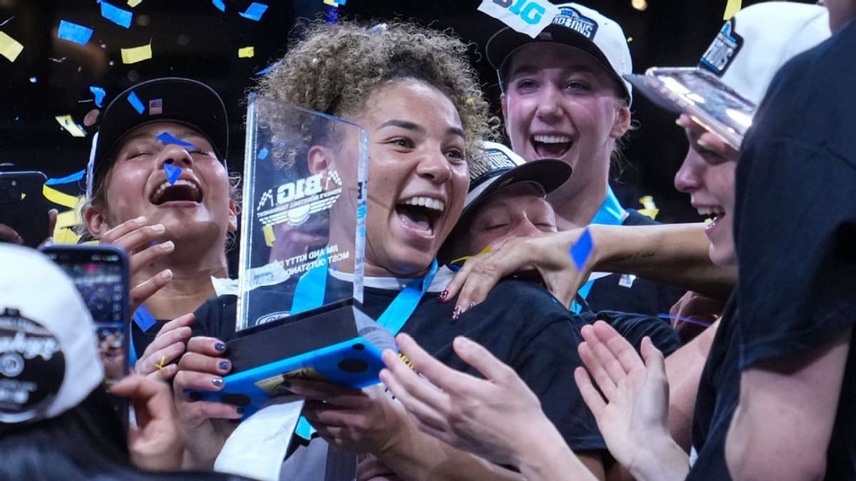 UCLA Bruins women's basketball team celebrating together after winning Big Ten tournament championship