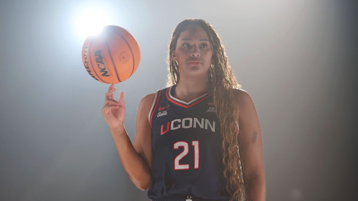 UConn basketball star Sarah Strong holding basketball on court during game action