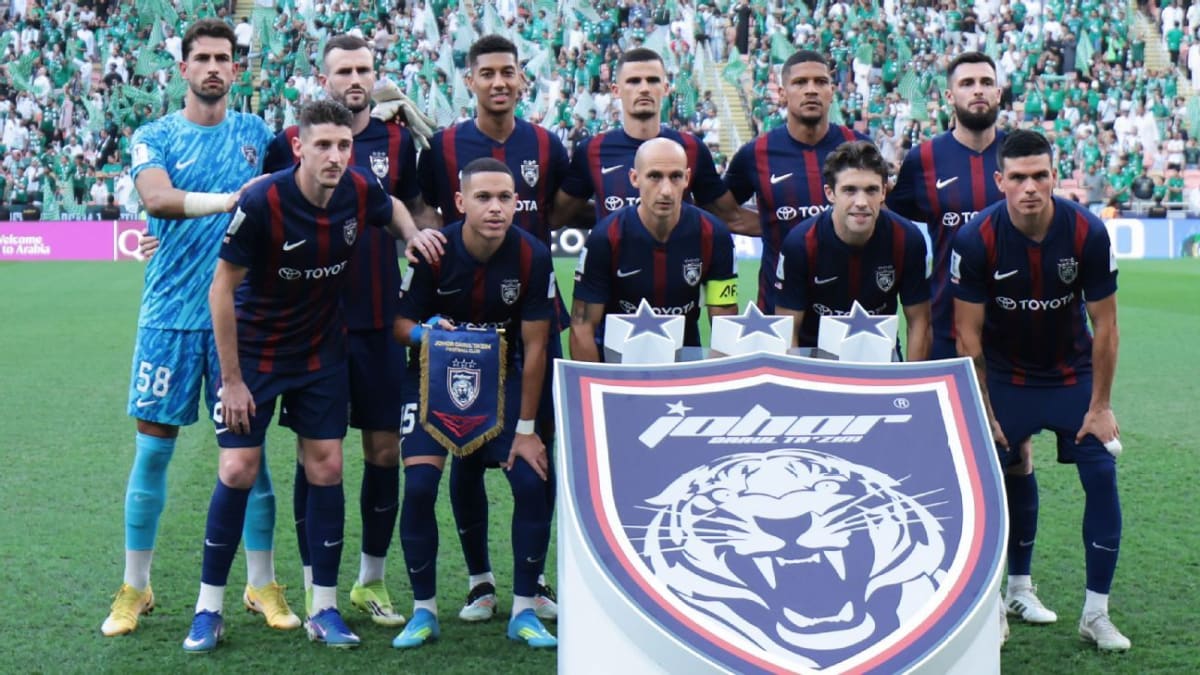 Johor Darul Ta'zim soccer players celebrating historic world record unbeaten streak achievement