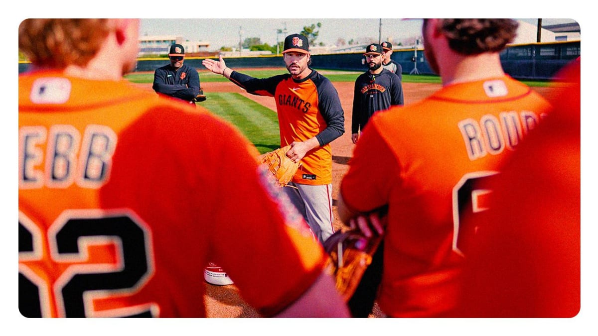 Tony Vitello in San Francisco Giants uniform talking to players during spring training practice