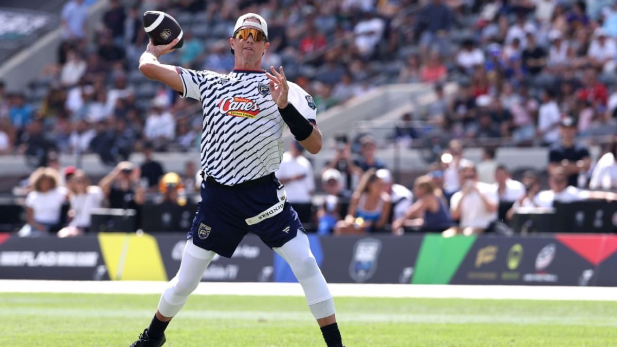 Tom Brady throwing a pass during flag football tournament at BMO Stadium in Los Angeles