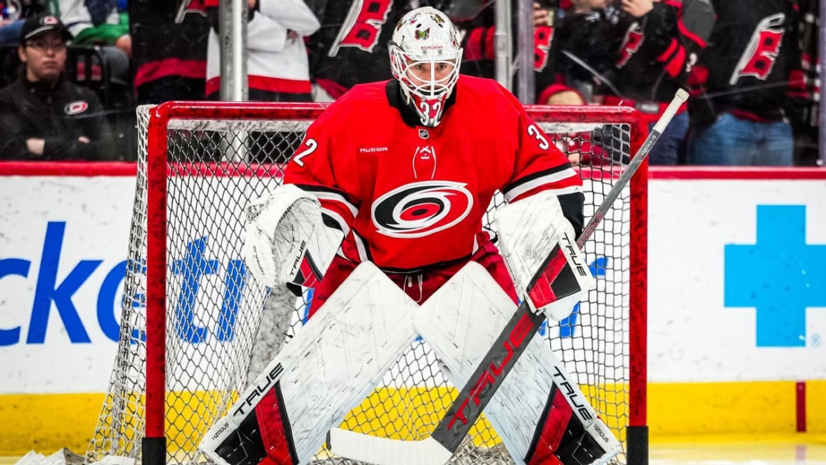 Carolina Hurricanes goalie Brandon Bussi wearing custom mask with colorful autism awareness symbols