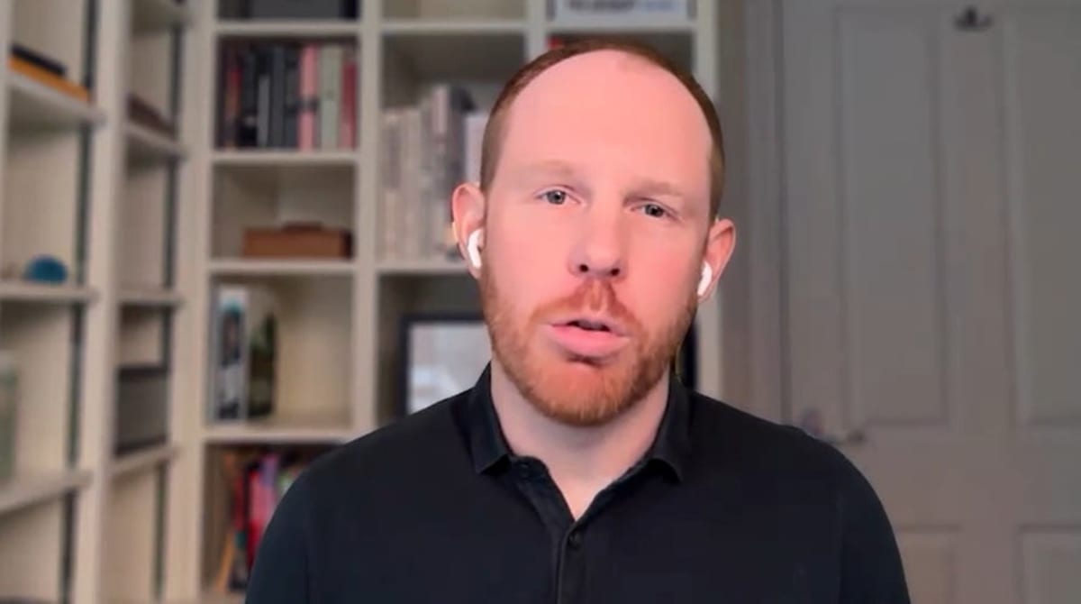 Person securing laptop with lock icon overlay representing email and digital account protection