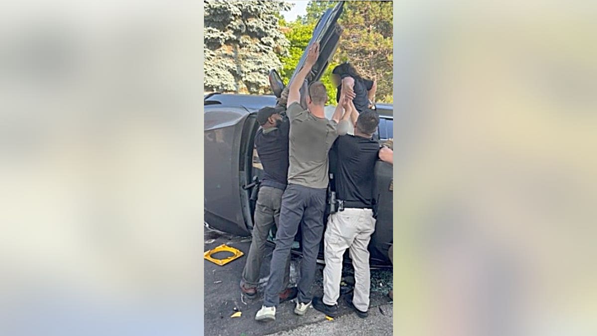 ICE Agents Rescue Woman Trapped in Milwaukee Rollover Crash - Image 5