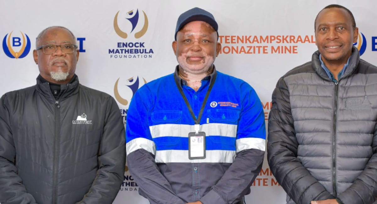Three South African executives celebrate rare earth mineral production breakthrough in laboratory