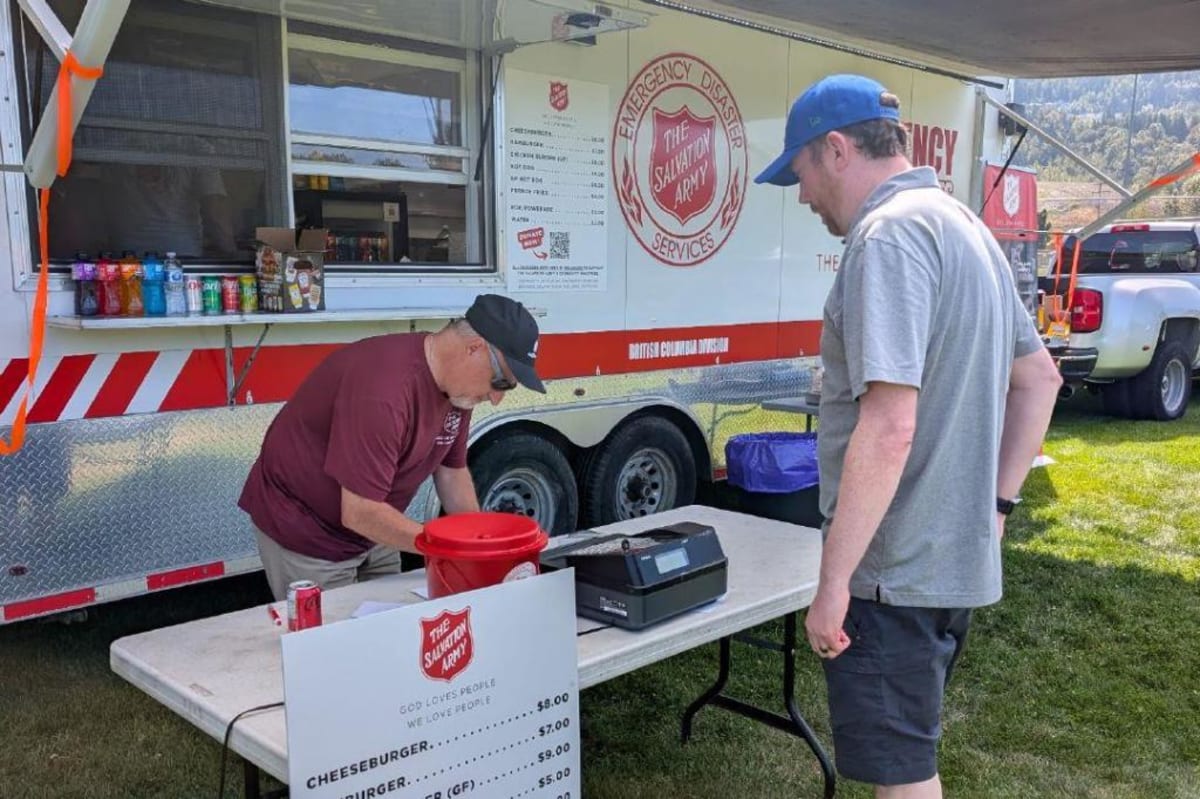 Softball players at charity tournament supporting wildfire evacuees in Chilliwack, British Columbia