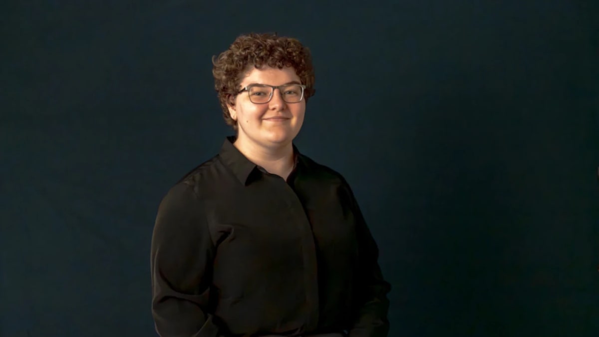 Young physics student MJ Keller working at computer analyzing telescope data from distant galaxies