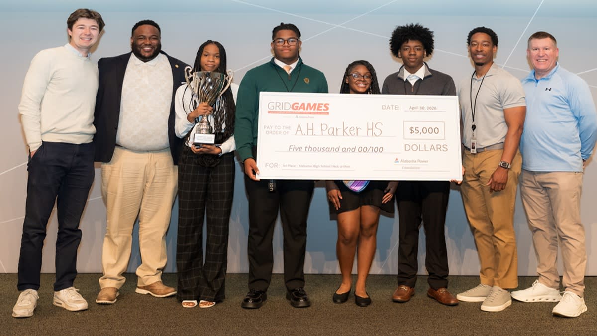 High school students presenting energy-efficient tiny home designs at Alabama Power hackathon competition