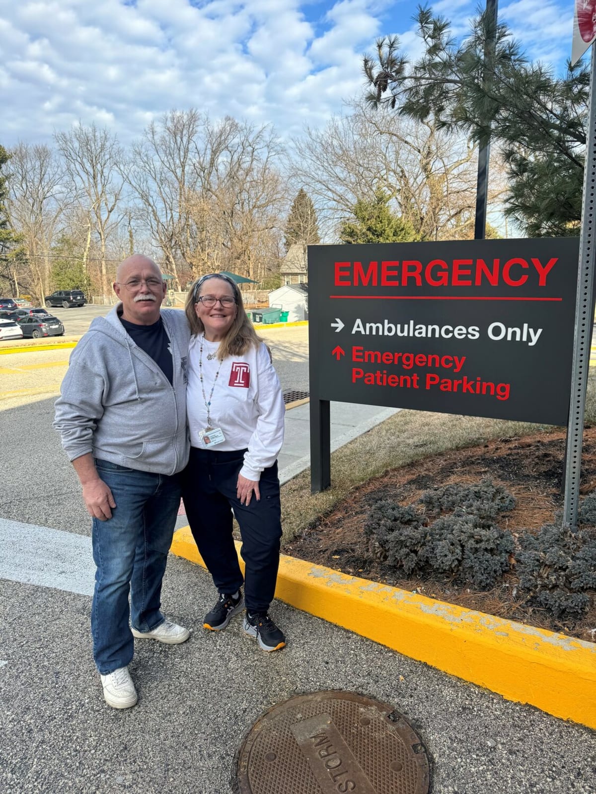 John Gallagher visiting Cindy Zimmerman at Chestnut Hill Hospital emergency department with flowers