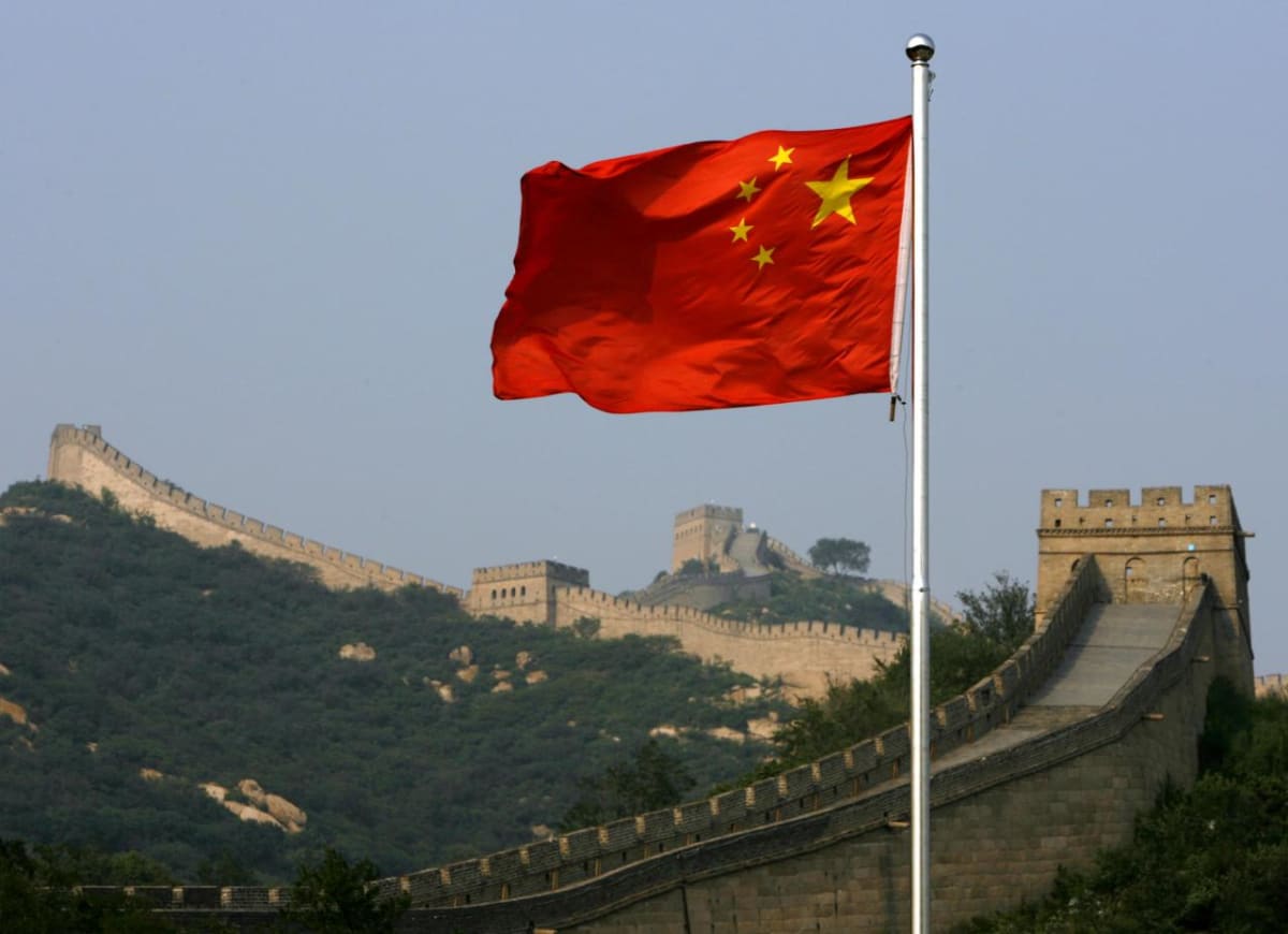 Athletes training at modern sports facility with Egyptian and Chinese flags displayed together
